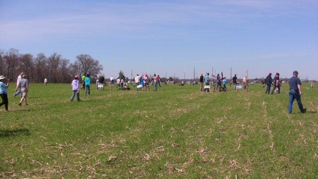 The field was crowded with
        rocketeers between launch racks