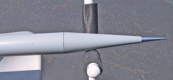 Nose cone with shear pin