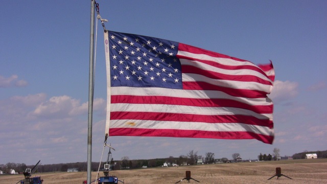 Stiff winds kept
        the flag flying